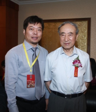 掌通家园执行总裁范宣波与教育部基础教育司原司长王文湛合影